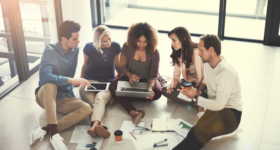 Group of young professionals in a brainstorming session in an office setting