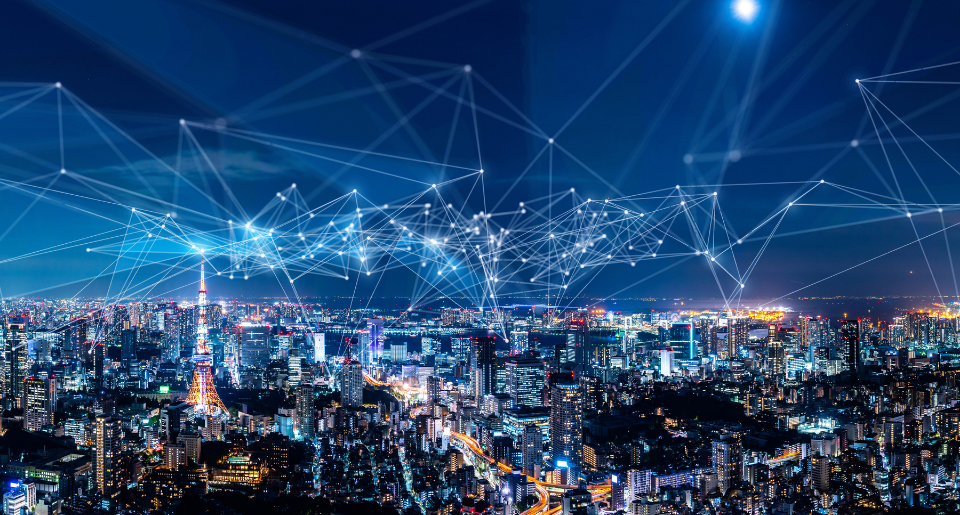 Nighttime skyline with internet signals crossing over the top