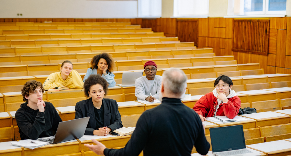 College classroom with instructor talking to students