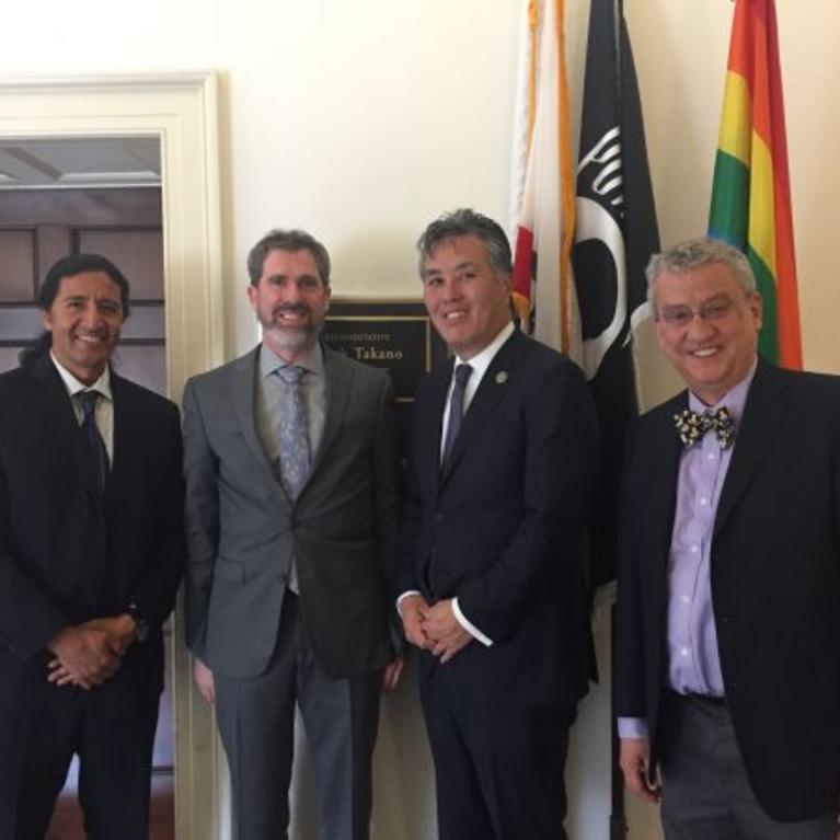 Kenneth N. Barish (left) with (from left to right) Manuel Calderón de la Barca Sánchez, a professor of physics at UC Davis; Rep. Mark Takano (D-Calif.); and Volker Koch, a physicist at Lawrence Berkeley National Laboratory