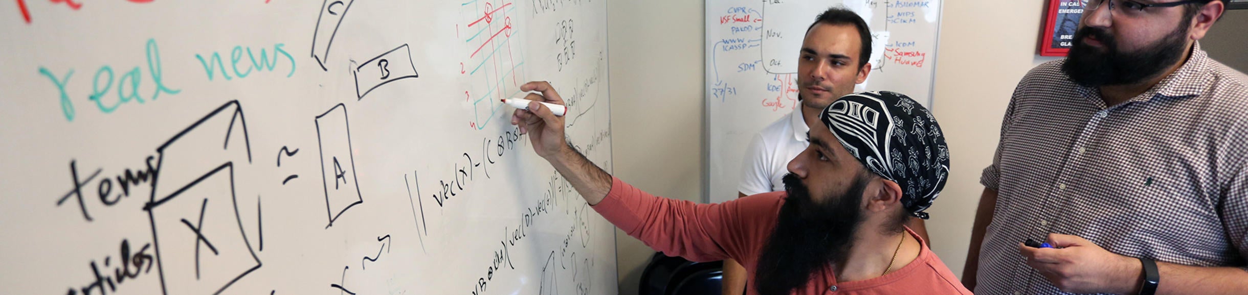 student at white board